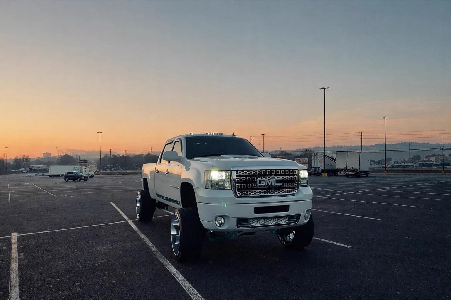 White GMC Denali HD on forged wheels at sunset